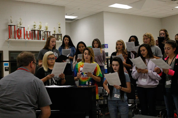 [File Photo] Choir prepares for competition by practicing during class. 
