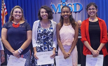 Moreno (right) poses with the rest of the MISD National Hispanic Scholars at the MISD Board Meeting. 