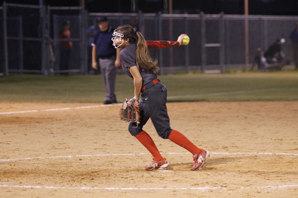 Jaycee Cook pitches the softball at a game against Royse City.