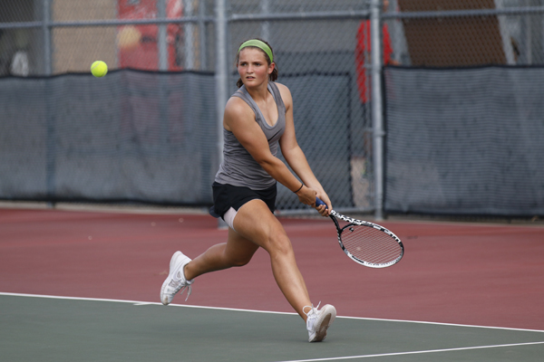 Kaitlyn Menting, 10, attempts to return a swing at a tennis match against Timberview.