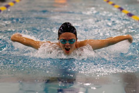Caitlyn Church, 9, swims the butterfly stroke in the Legacy meet at the Mansfield ISD Natatorium. Church swam the 100 fly on Oct. 5 and helped the girls varsity swim team gain points against Byron Nelson. (Megan Bell photo)  