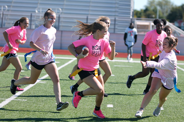 The sophomores and juniors play against each other during Pink Fests powderpuff football game. 