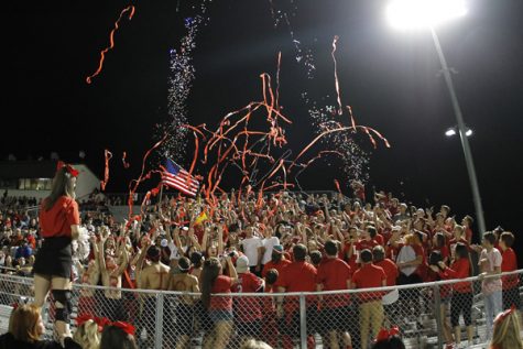 Legacy student section celebrates during the Summit football game.