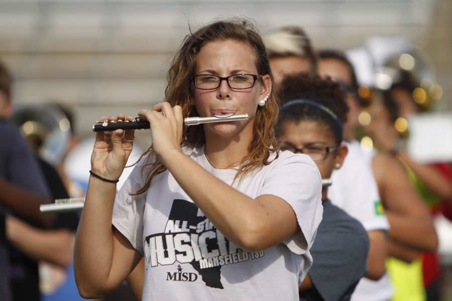 Jacqueline Lum, 12, plays her piccolo during band rehearsal. Lum has been in the band all four years and made All-State her senior year. 