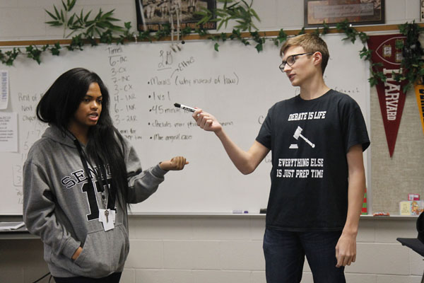 Senior Alyssa Crosby and junior Ben Schnuck explain the difference between LD and CX debate. Debate practices every Thursday after school in Mr. Ritzs room. 