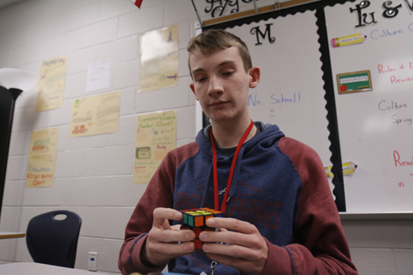 Joshua Trentham, 12, solves a Rubiks cube. 