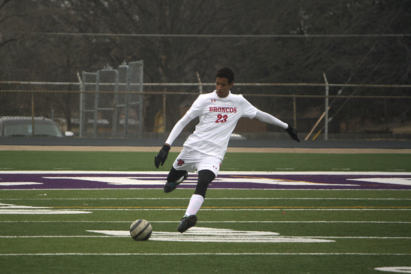 Junior Tristian Adams kicks the soccer ball to his teammate at a soccer tournament on Jan. 4. 
