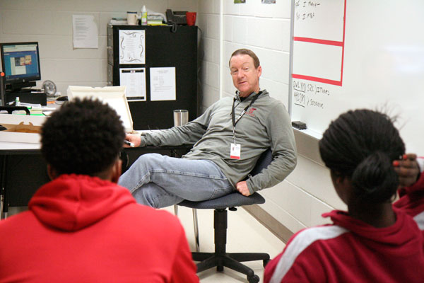 Coach Burke leads a discussion in the weekly Future Christian Athletes  (FCA) meeting. Students meet in Coach Burkes room, I103, at 6:50 a.m. every Friday morning for devotional and donuts. 