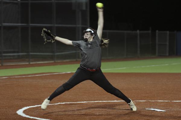 Sierra Skidmore, 9, pitches during a varsity softball game against Boswell. Skidmore has been pitching for the varsity softball team because of multiple injured players. 