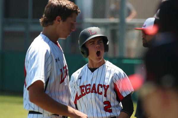 Carter Steenbakkers, 12, cheers after a successful hit. The Broncos advanced into the second round of playoffs. 