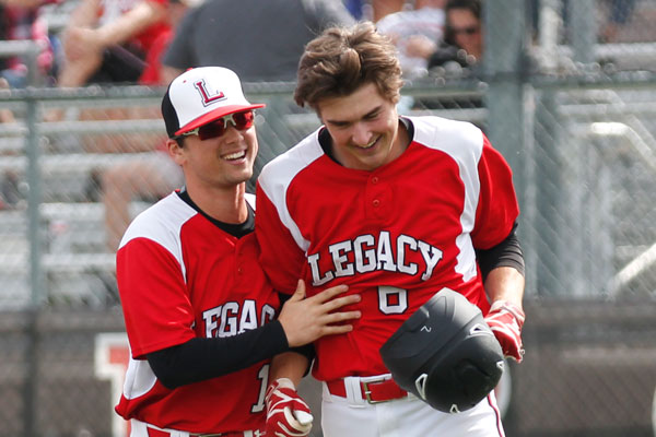 Senior Grant Moore walks alongside his teammate. 