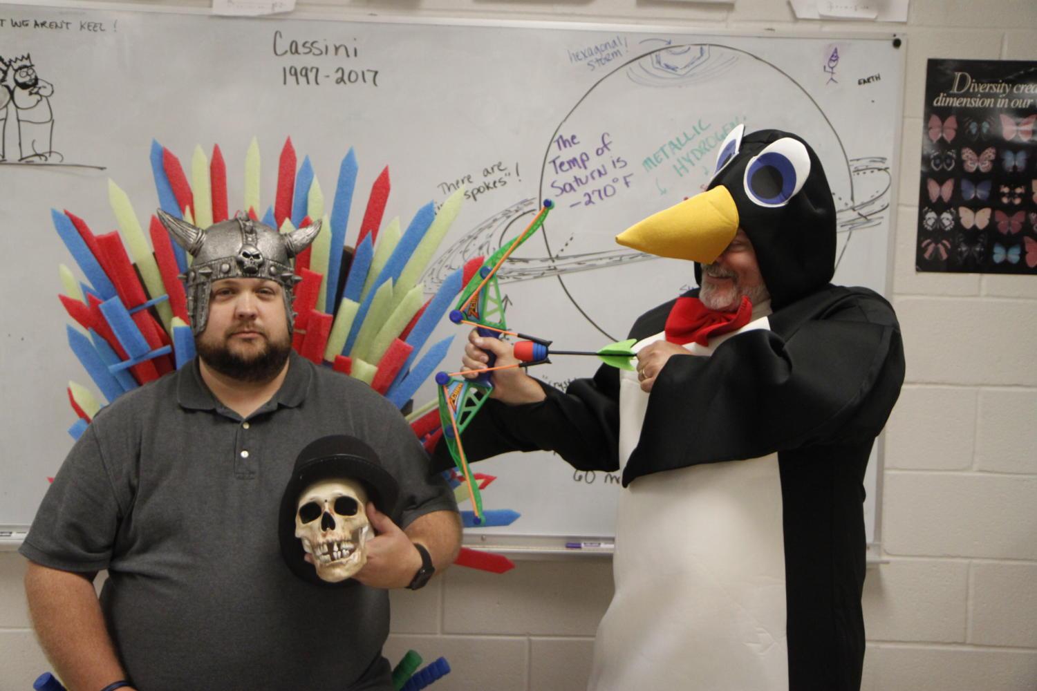 Dressed as a Viking and a penguin, Mr. John Sudbury and Mr. John Davis pose for a photo to demonstrate their unique relationship.