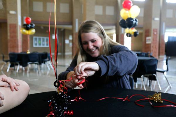 Brooke Bussey sets up for the Bronco Ball hosted by NHS students.