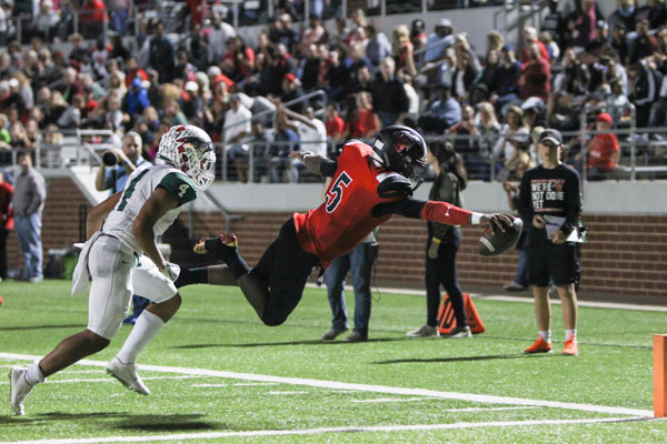 Jalon Catalon, 11, dives over the endzone in a 39-34 homecoming win over Waxahachie.