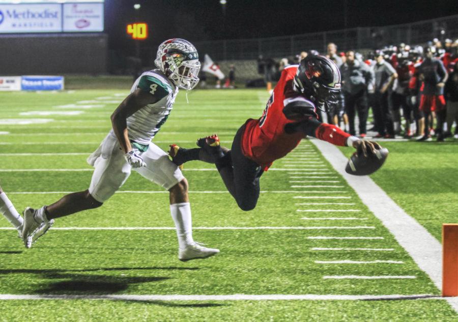 Jalen Catalon, 11, dives in to the endzone to score a touchdown for Legacy. Legacy went on to win against Waxahachie. (Kassidy Duncan photo)