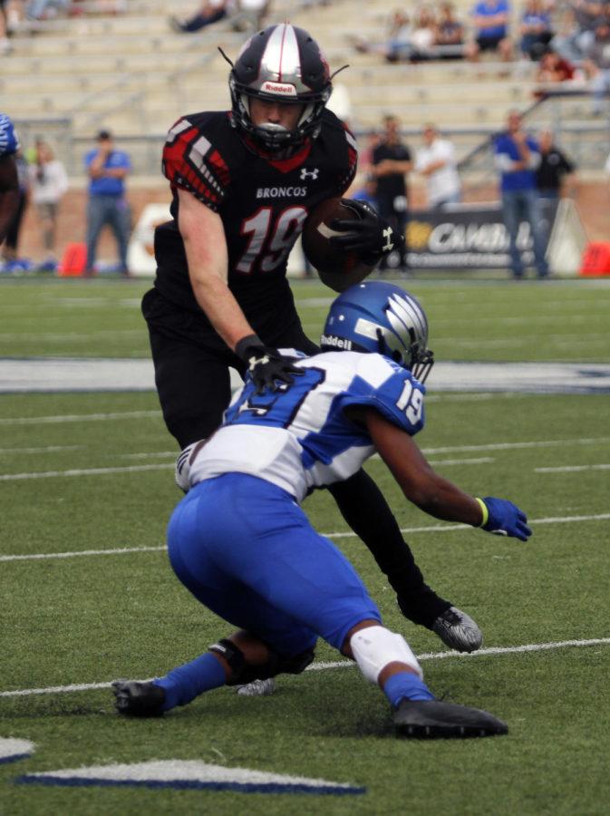 Nathan Rooney, 11, shoves the defending team off of him to attempt and score a touchdown. Legacy won against North Forney and will play in round four of the playoffs. (Kassidy Duncan photo)