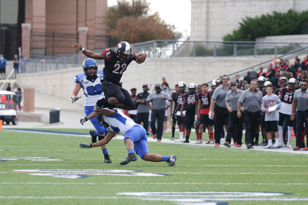 Grant Johnson, 12, jumps over a defender during the Broncos third round playoff match against North Forney. The Broncos won 45-35 to advance to the fourth round. 