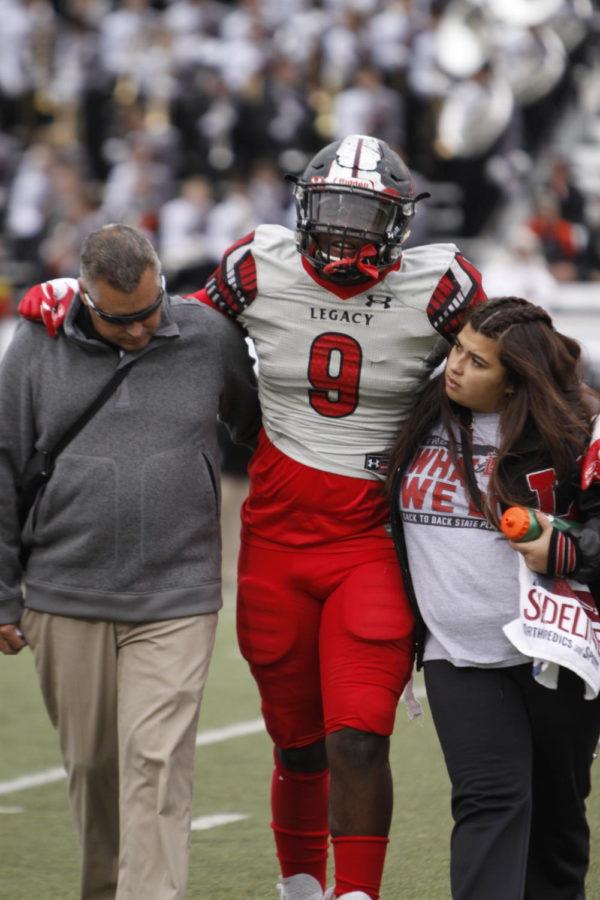 Taurean Carter JR, 11, walks off the field after an injury. Carters injury was early on in the game and he went back in to play. (Dalton Mix photo)