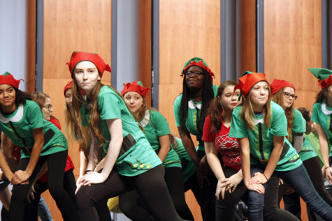 Members of the Legacy Musical Theatre class perform songs from their play Elf Jr. at the MISD Toys for Tots event on Dec. 6. A record crowd of students, parents, faculty. and children came out to celebrate the giving of 3,583 toys donated by MISD schools. 