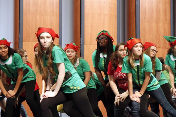 Members of the Legacy Musical Theatre class perform songs from their play "Elf Jr." at the MISD Toys for Tots event on Dec. 6. A record crowd of students, parents, faculty. and children came out to celebrate the giving of 3,583 toys donated by MISD schools. 