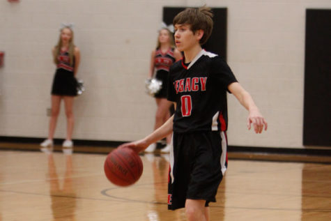 Eli Riley, 9, takes the ball down the court during the freshmen A basketball match against Lake Ridge on Jan. 12. 