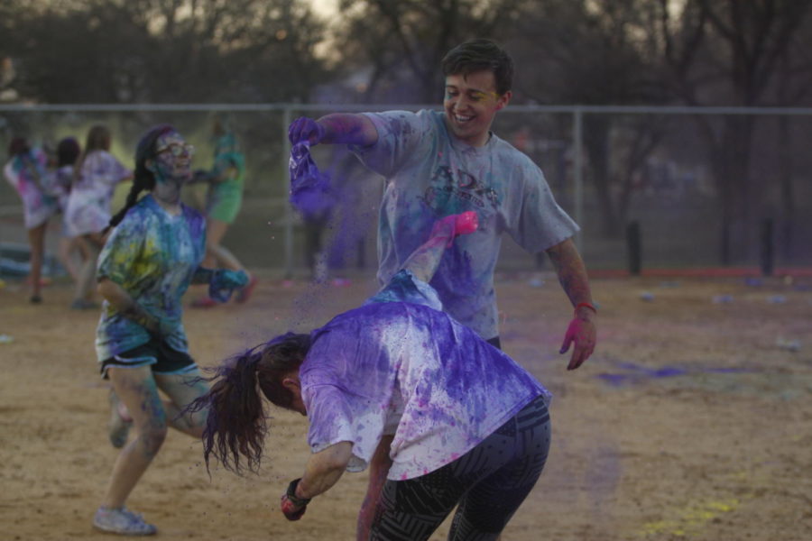 Jorden Melson, 11,dumps colored powder on another student during color clash. Students participated in the clash to raise money for Amanda Ferguson. (Dalton Mix photo)