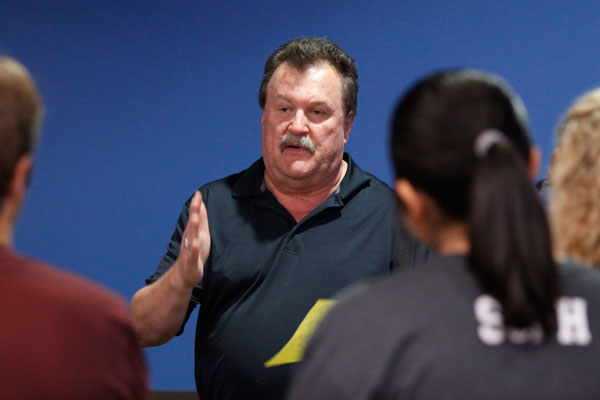 Coach Mike Young talks to prospective bowlers during try outs on Oct. 5. The Boys' varsity bowling team place second at the regional round and qualified for state. 