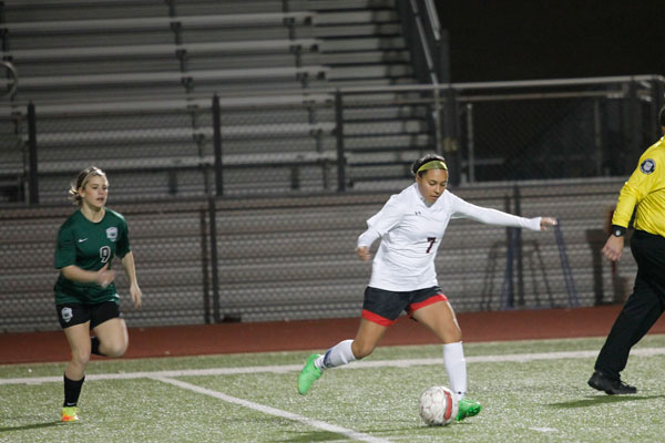 Dezaire Rodriguez, 12, draws her leg back and prepares to kick the ball. Girls Soccer will face Crowley in the first round on March 29 at 6 p.m.