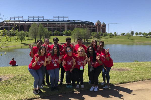 Student Council members throw up their Ls in front of Globe Life Park in Arlington. StuCo members attended a state student council convention to learn how to better lead their peers and boost school spirit. Courtesy Photo