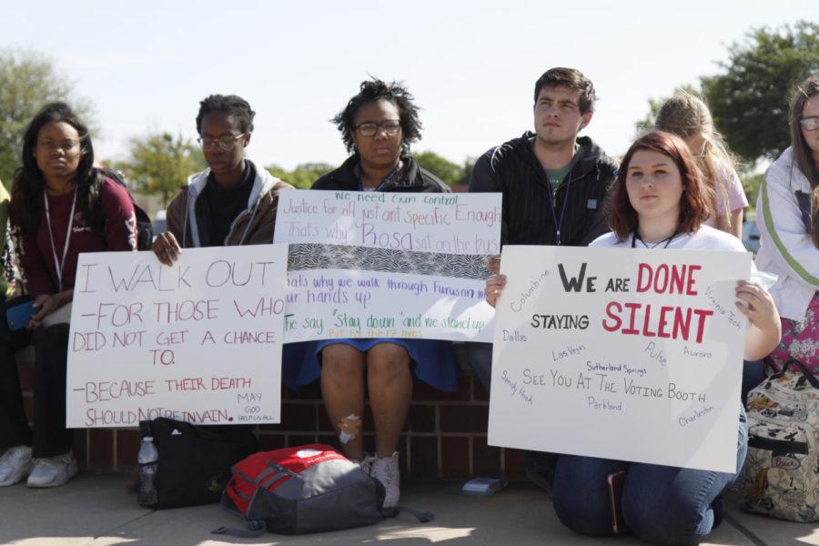  Students sit in silence and protest gun violence. The walk-out occurred on April 20th. (Dalton Mix photo)