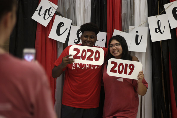 At the Legacy's annual Westside Picnic, Lexus Ramos, 11, and Michael Cooper, 10 pose in front of a photo booth made by the student council. The picnic encourage community among all of Legacy's feeder schools.