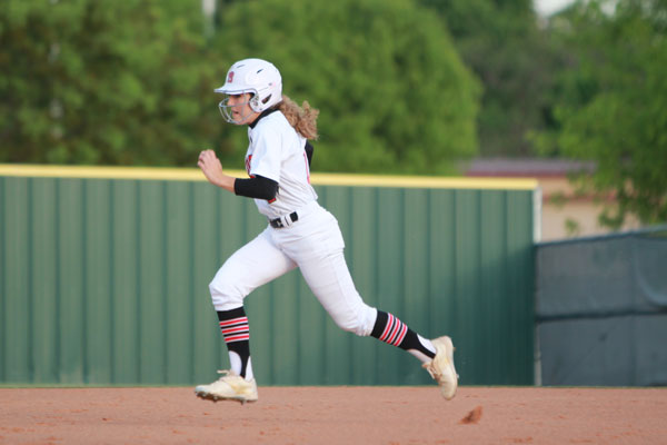 Julia Plasket, 11, runs the bases 