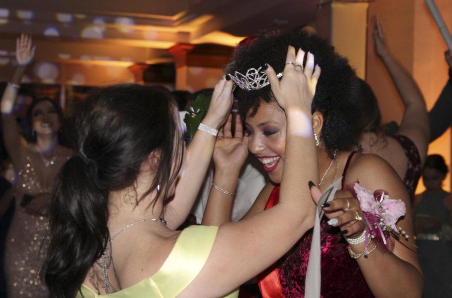 Athena Orza, 12, crowns Cyliest Smith, 12, as Prom Queen. Smith was also named Best Dressed. (Kassidy Duncan photo) 