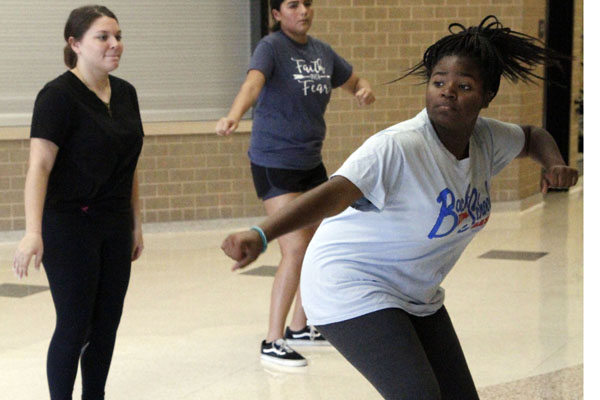 The capitan of the Step team, Amara Shanks teaches the girls the first and second lieutenant tryout step routine. Tryout dates are on 8/29/18.