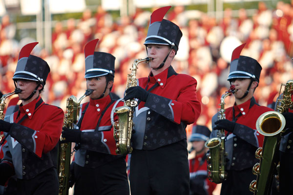 Saxophone players perform their marching show, Man vs Machine, before the football game begins. (Kristen Bosecker photo)