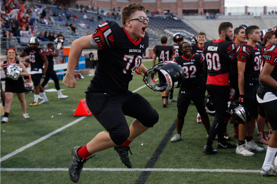 Cameron Chlup, 12, celebrates after the Broncos win against North Forney in the third round of playoffs. 