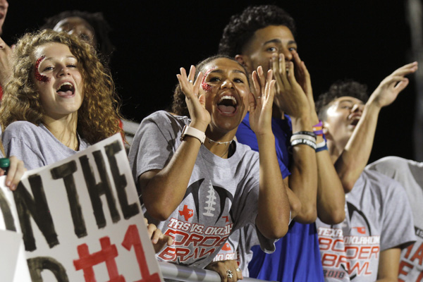 At the Oklahoma game against Jenks High School, Keslyn King, 12, cheers. Legacy lost 35-14 on August 31.