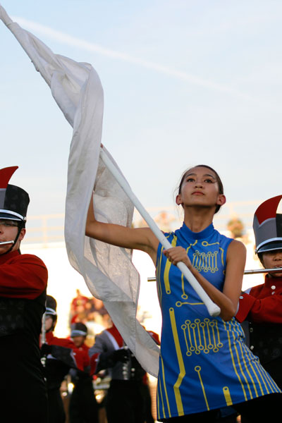 Lara Jean Covey, 9, performs with color guard before the football game begins. (Kassidy Duncan photo)