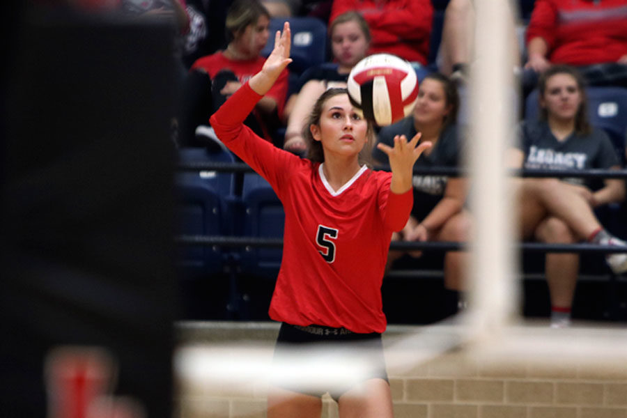 Kenzie Flowers, 12, serves the ball against Timberview.