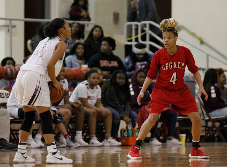 Harmoni Turner, 11, defends the point guard against Red Oak