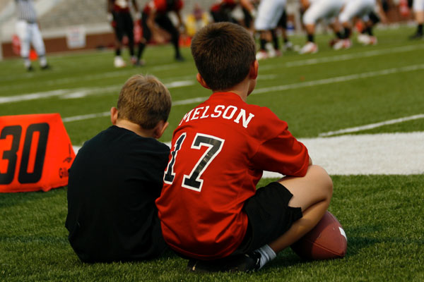 Jorden Melson, 12, sits on the sidelines with his brother Major Melson in 2007. 
