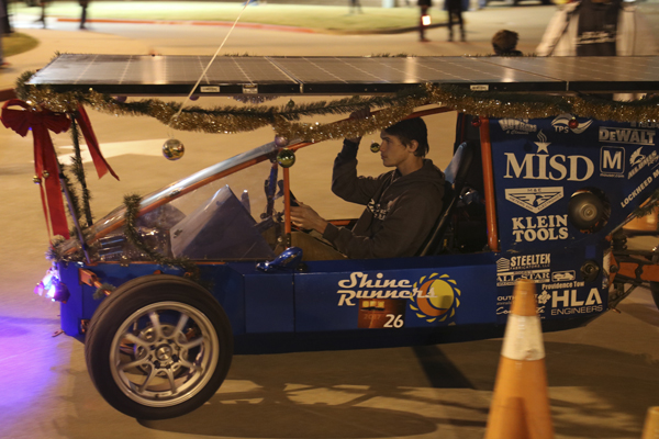 Josh Brown, 12, rides in a car a Ben Barber class built at Toys for Tots. The event will start at 5 p.m. at the Center.