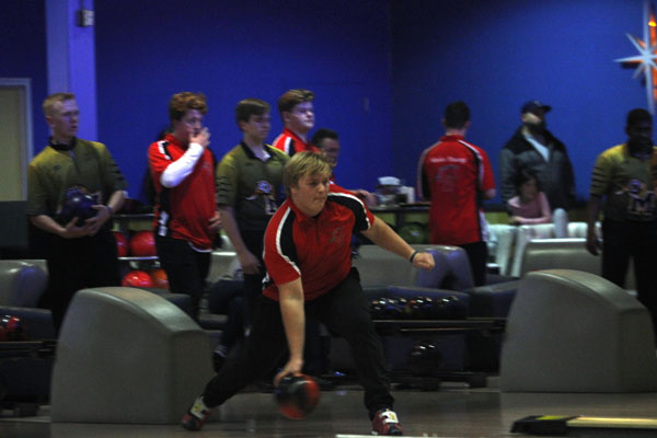 Ty Flores, 12, bowls against Mansfield High School on Dec. 13th. 