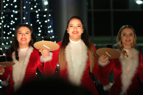Laysha Guerrero, 12, Savannah Campos, 11, and Grace Harrison, 11, perform the Hot Chocolate dance at Toys for Tots on Dec. 5. (Ellie Brutsche photo)

