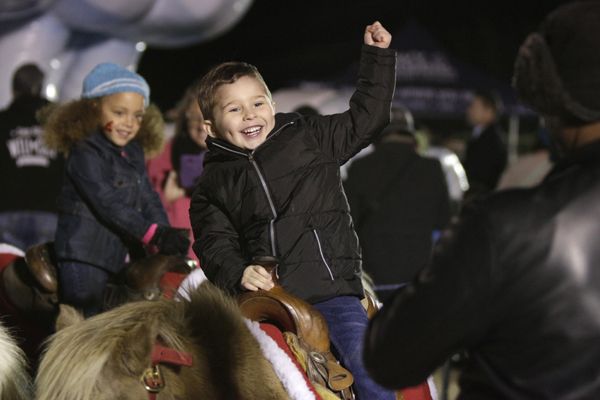 Child rides a pony at the annual Toys for Tots event on Dec. 5. 