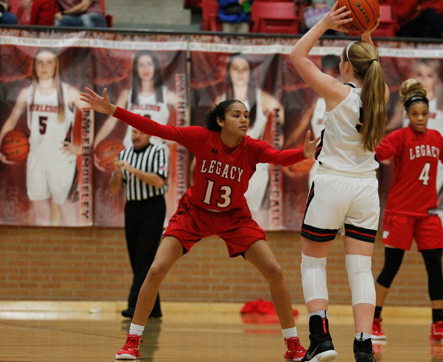 Keslyn King, 12, defends a point guard against Burleson.
