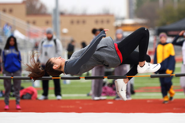 Ana Copland, 9, practices during warmups for high jump. (Conner Riley photo)