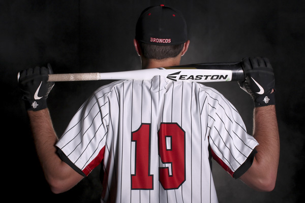 Nate Rombach, 12, posed with his bat in the studio for a picture. Romach chose his number because it comforted him during the game. 