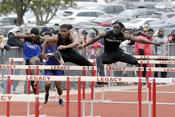 Tru Edwards, 12, jumps over a hurdle on at the track meet on Feb. 16. The team hopes to make state like last year. 