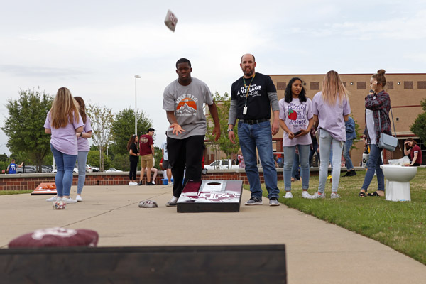 Clyde Davis, 12, throws a bean bag during a game of cornhole. The westside picnic took place on April 16 and Legacy feeder schools attended. 